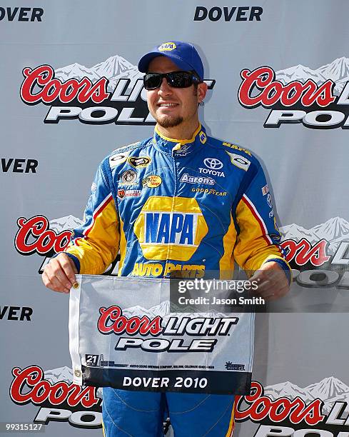 Martin Truex Jr., driver of the NAPA Auto Parts Toyota, poses in Victory Lane after qualifying for the pole position in the NASCAR Sprint Cup Series...