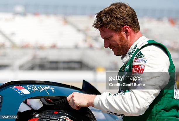 Dale Earnhardt Jr., driver of the AMP Energy/National Guard Chevrolet, stands on the grid during qualifying for the NASCAR Sprint Cup Series Autism...