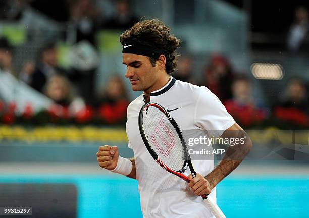 Switzerland's Roger Ferderer reacts after winning against Latvia's Ernests Gulbis during their match at the Madrid Masters on May 14, 2010 at the...