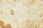 Texture of old moldy paper with dirt stains, spots, inclusions cellulose, brown cardboard texture background, grunge vintage background