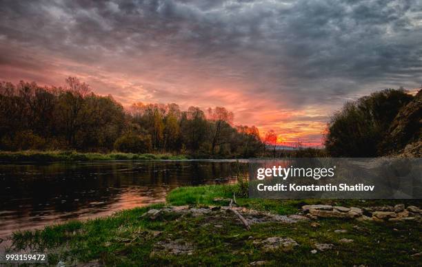 sunrise on the river beautiful sword - shatilov stock pictures, royalty-free photos & images