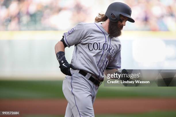 Charlie Blackmon of the Colorado Rockies rounds third after hitting a home run off of Felix Hernandez of the Seattle Mariners in the first inning at...