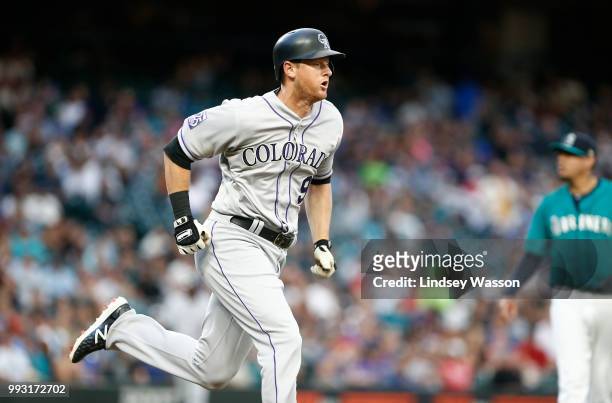 LeMahieu of the Colorado Rockies runs to first safely on a wild pitch by Felix Hernandez of the Seattle Mariners in the fifth inning at Safeco Field...