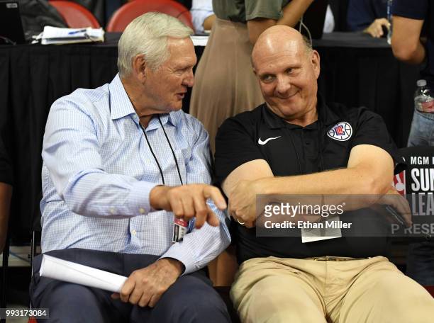 Los Angeles Clippers executive board member Jerry West and Clippers owner Steve Ballmer talk as they attend a 2018 NBA Summer League game between the...