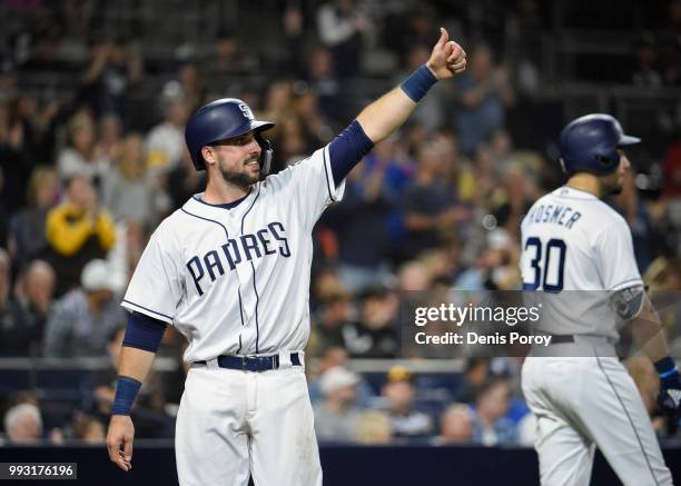 Austin Hedges of the San Diego Padres celebrates during a baseball game against the Pittsburgh Pirates at PETCO Park on June 30, 2018 in San Diego,...