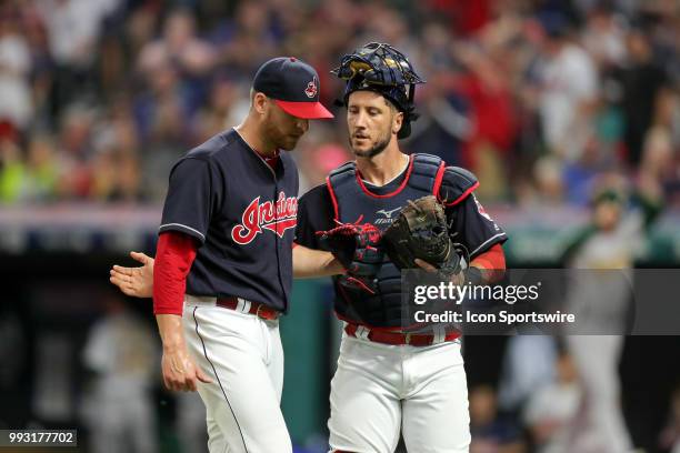 Cleveland Indians catcher Yan Gomes congratulates Cleveland Indians pitcher Neil Ramirez after Ramirez struck out Oakland Athletics designated hitter...