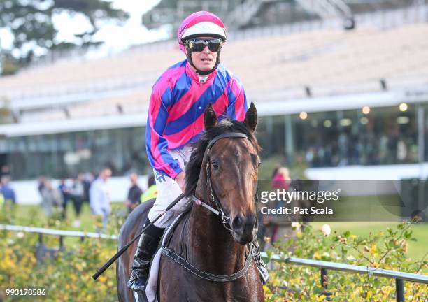 Luke Nolen returns to the mounting yard on Good 'n' Fast after winning the Taj Rossi Series Final , at Flemington Racecourse on July 07, 2018 in...