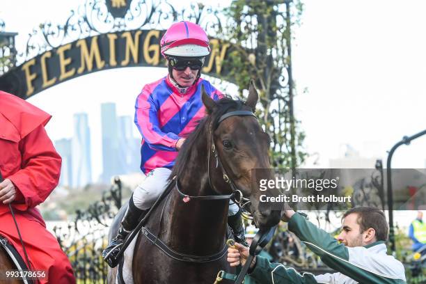 Luke Nolen returns to the mounting yard on Good 'n' Fast after winning the Taj Rossi Series Final at Flemington Racecourse on July 07, 2018 in...