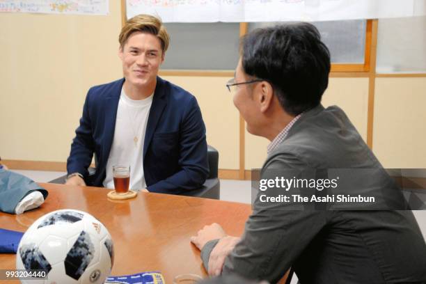 Football player Gotoku Sakai talks with Sanjo City Mayor Isato Kunisada during his visit to the Sanjo City Hall on July 6, 2018 in Sanjo, Niigata,...