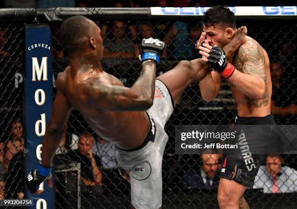 Israel Adesanya of Nigeria kicks Brad Tavares in their middleweight bout during The Ultimate Fighter Finale event inside The Pearl concert theater at...