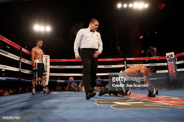 Ernesto Guerrero is knocked down in the fifth round by Rigoberto Hermosillo during the Super Featherweight fight of LA Fight Club at The Belasco...