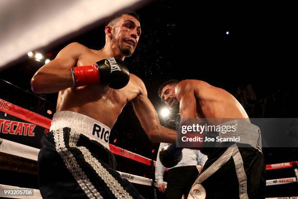 Rigoberto Hermosillo connects a punch to Ernesto Guerrero in the fourth round of the Super Featherweight fight of LA Fight Club at The Belasco...