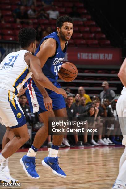 Grant Jerrett of the LA Clippers handles the ball against the Golden State Warriors during the 2018 Las Vegas Summer League on July 6, 2018 at the...