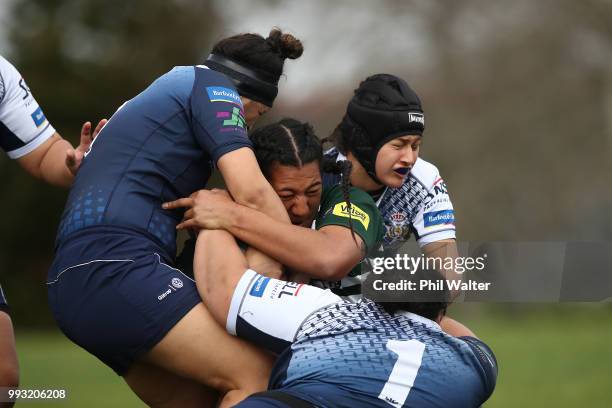 Harano Te Iringa of Manurewa is tackled during the women's Rugby match between Manurewa and College Rifles at Mountford Park on July 7, 2018 in...