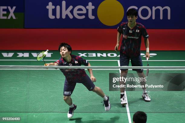 Takuto Inoue and Yuki Kaneko of Japan compete against Liao Min Chun and Su Ching Heng of Chinese Taipei during the Men's Doubles Semi-final match on...