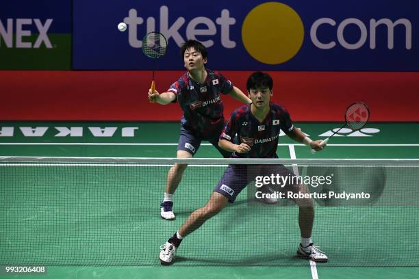 Takuto Inoue and Yuki Kaneko of Japan compete against Liao Min Chun and Su Ching Heng of Chinese Taipei during the Men's Doubles Semi-final match on...