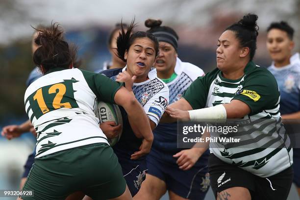 Sima Hala of College Rifles is tackled during the women's Rugby match between Manurewa and College Rifles at Mountford Park on July 7, 2018 in...