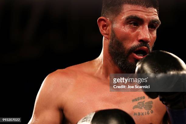 Ernesto Guerrero takes a tired look at Rigoberto Hermosillo during the Super Featherweight fight of LA Fight Club at The Belasco Theater on July 6,...