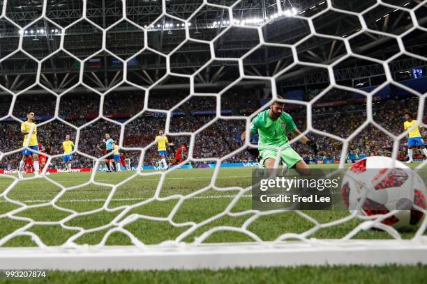 Kevin De Bruyne of Belgium scores past Alisson of Brazil his team's second goal during the 2018 FIFA World Cup Russia Quarter Final match between...