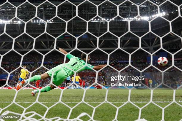 Kevin De Bruyne of Belgium scores past Alisson of Brazil his team's second goal during the 2018 FIFA World Cup Russia Quarter Final match between...