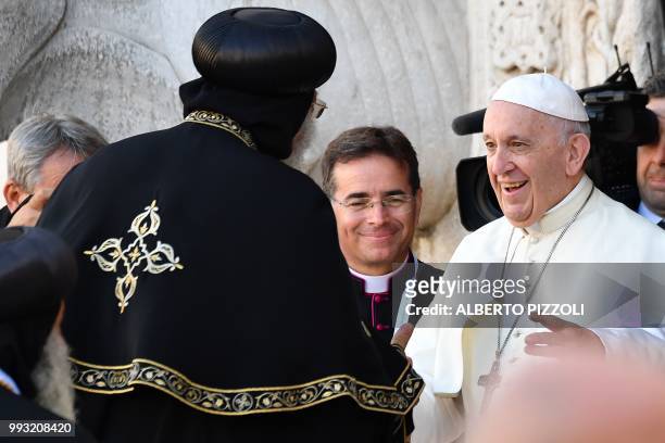 Pope Francis greets Egypt's Coptic Orthodox Pope Tawadros II in front of the Pontifical Basilica of St Nicholas in Bari, in the Apulia region in...