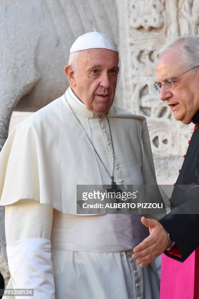 Pope Francis waits to greet religious leaders in front of the Pontifical Basilica of St Nicholas in Bari, in the Apulia region in southern Italy, on...