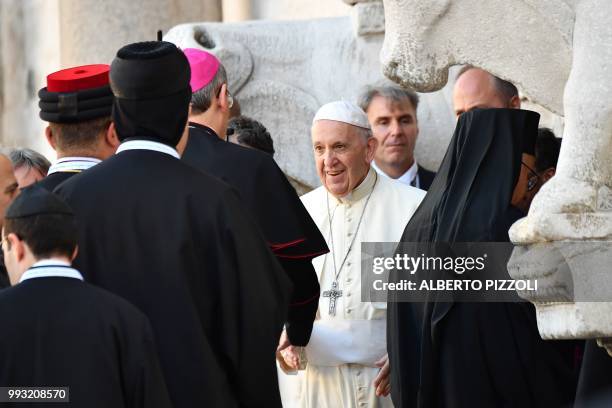 Pope Francis welcomes religious leaders in front of the Pontifical Basilica of St Nicholas in Bari, in the Apulia region in southern Italy, on July...