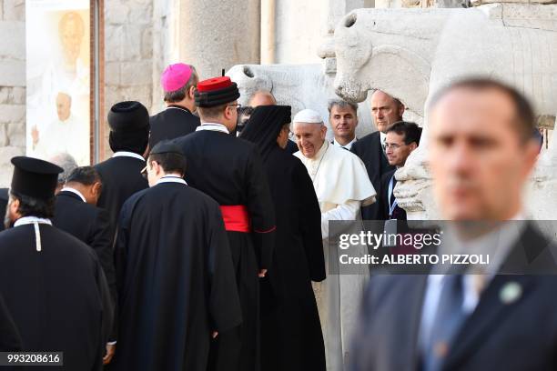 Pope Francis welcomes religious leaders at the Pontifical Basilica of St Nicholas in Bari, in the Apulia region in southern Italy, on July 7, 2018. -...