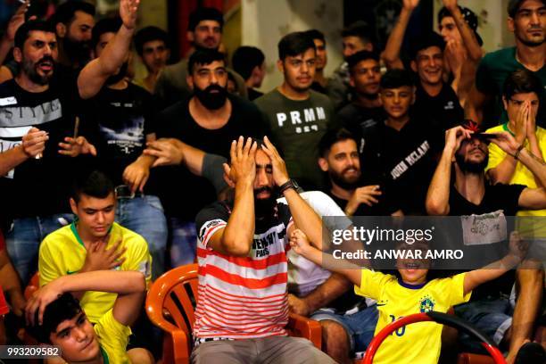 Lebanese fans watch the Russia 2018 World Cup quarter-final football match between Brazil and Belgium in the Ersal district, southern Beirut, on July...