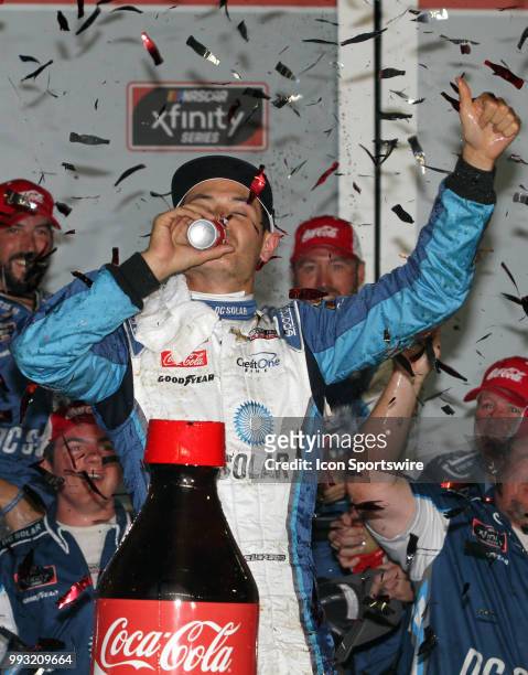 Kyle Larson celebrates winning the NASCAR Xfinity Series Coca Cola Firecracker 250 on July 6, 2018 at Daytona International Speedway, Daytona Beach,...