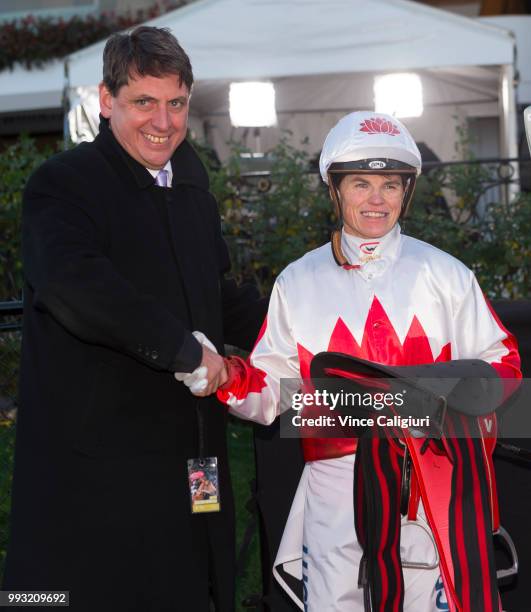 Chairman of Stewards Terry Bailey congratulates Craig Williams after riding Camdus in Race 9 to give him six for the day during Melbourne Racing at...