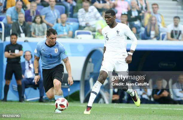 Paul Pogba of France, Cristian Rodriguez of Uruguay during the 2018 FIFA World Cup Russia Quarter Final match between Uruguay and France at Nizhny...