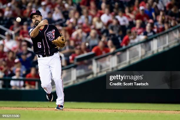 Anthony Rendon of the Washington Nationals makes the throw to first to retire Martin Prado of the Miami Marlins during the eighth inning at Nationals...