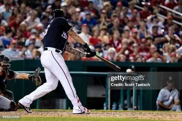 Matt Adams of the Washington Nationals singles to load the bases against the Miami Marlins during the eighth inning at Nationals Park on July 06,...