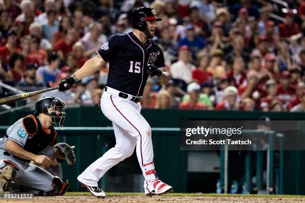Matt Adams of the Washington Nationals singles to load the bases against the Miami Marlins during the eighth inning at Nationals Park on July 06,...