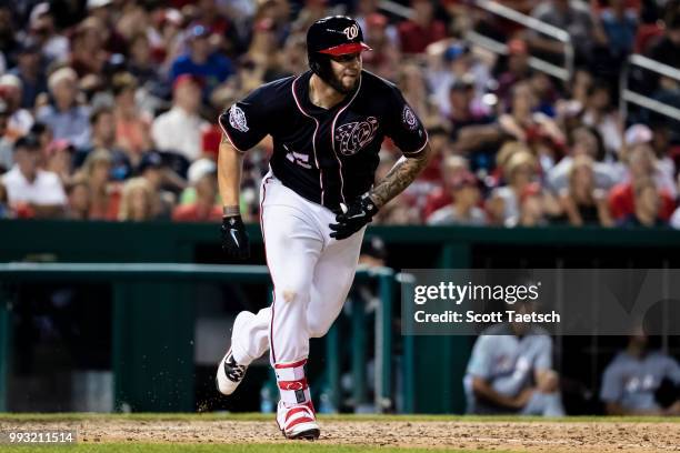 Matt Adams of the Washington Nationals singles to load the bases against the Miami Marlins during the eighth inning at Nationals Park on July 06,...