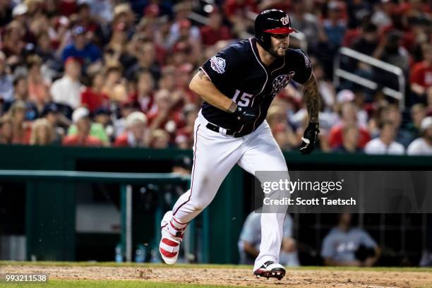 Matt Adams of the Washington Nationals singles to load the bases against the Miami Marlins during the eighth inning at Nationals Park on July 06,...