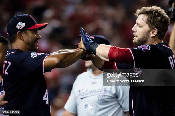 Mark Reynolds of the Washington Nationals celebrates with manager Dave Martinez after hiting the game winning home run against the Miami Marlins...