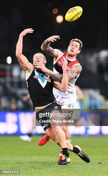 Tim Membrey of the Saints spoils Tom Clurey of Port Adelaide during the round 16 AFL match between the Port Adelaide Power and the St Kilda Saints at...