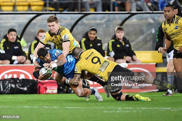 Augustine Pulu of the Blues is tackled during the round 18 Super Rugby match between the Hurricanes and the Blues at Westpac Stadium on July 7, 2018...