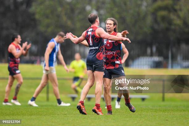 Nathan Foote and Jack Hutchins of the Casey Demons celebrate a goal during the VFL round 14 game between the Casey Demons and North Melbourne at...