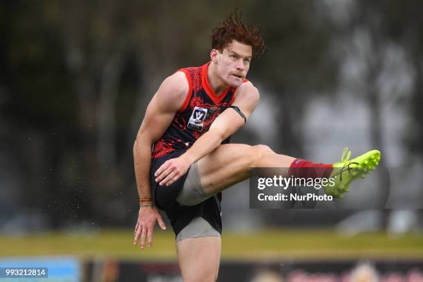 Mitch Hannan of the Casey Demons kicks the ball during the VFL round 14 game between the Casey Demons and North Melbourne at Casey Fields in...