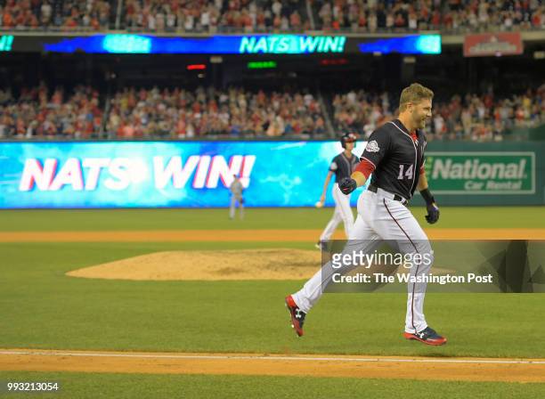 Washington's Mark Reynolds heads home after hitting a tie breaker home run to win the game in the bottom of the 9th ninth inning during the...