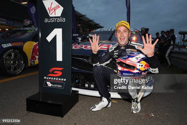 Jamie Whincup driver of the Red Bull Holden Racing Team Holden Commodore ZB celebrates after winning race 17 for the Supercars Townsville 400 on July...