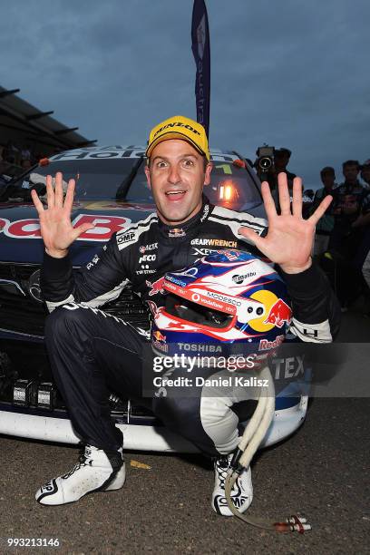 Jamie Whincup driver of the Red Bull Holden Racing Team Holden Commodore ZB celebrates after winning race 17 for the Supercars Townsville 400 on July...