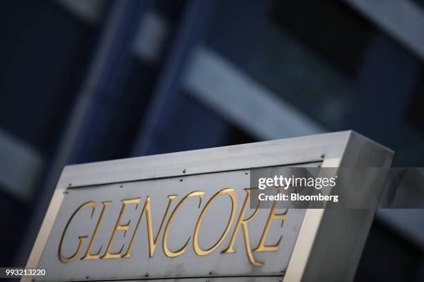 Signage stands near the Glencore Plc headquarters office in Baar, Switzerland, on Friday, July 6, 2018. Glencore will buy back as much as $1 billion...
