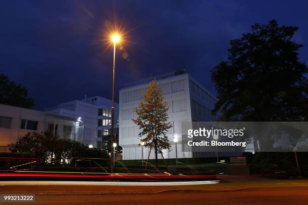 Light trails from traffic pass in front of the Glencore Plc headquarters office in Baar, Switzerland, on Friday, July 6, 2018. Glencore will buy back...