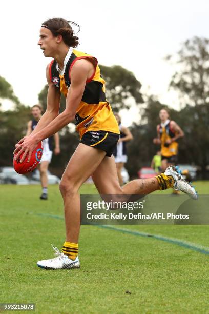 William Hamill of the Dandenong Stingrays kicks the ball during the round 11 TAC Cup match between Dandenong Stingrays and Geelong Falcons at Shepley...