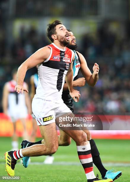 Billy Longer of the Saints rucks a throw in against Paddy Ryder of Port Adelaide during the round 16 AFL match between the Port Adelaide Power and...