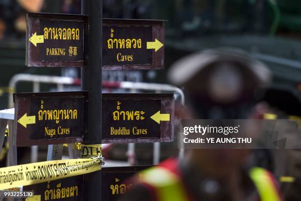 Thai policemen are posted around the Tham Luang cave area as rescue operation continues for the 12 boys and their football team coach trapped in the...